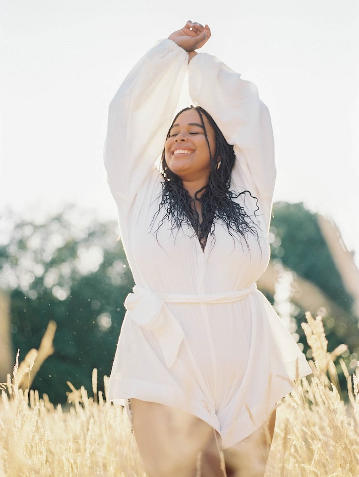 Woman feeling strong and confident after completing a personalized medical weight loss program